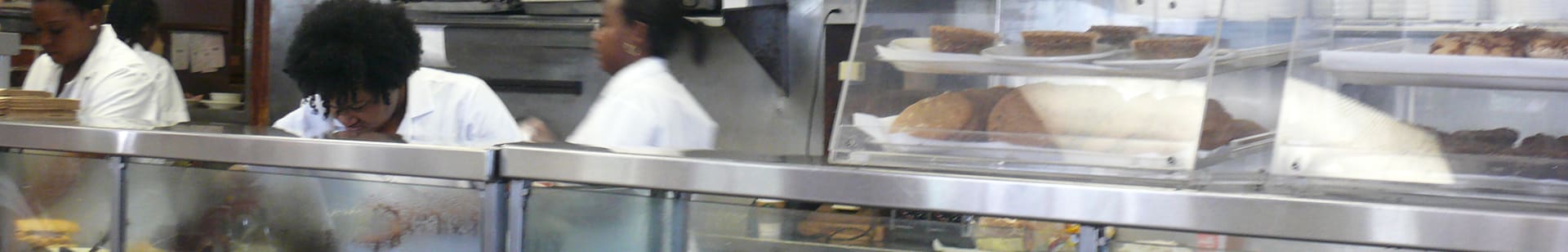 woman wearing white uniform working in the kitchen